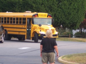 The school bus arriving at school on the first day. I drive to school to meet the bus at school on the first day of kindergarten for each child.