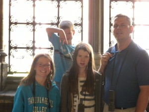 The kids and Dad at the Cloisters in Westminster Abbey. The 6-year-old is saying "Majide" from "I Survived a Japanese Game Show!" 